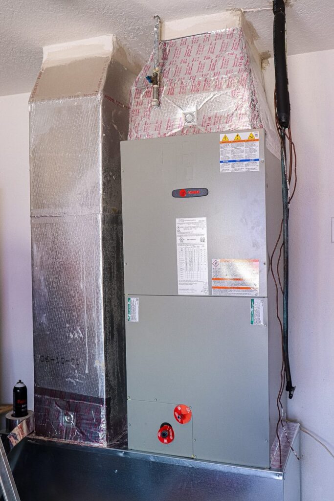After AC replacement: new Trane air handler installed on a new platform with sealed ductwork in Tampa